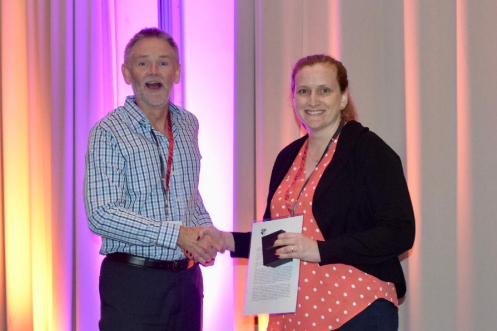 Jennifer Flegg receiving the JH Michel Medal at the ANZIAM 2020 conference dinner.